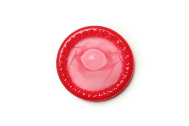 istock Single red condom isolated on white background 1303884819