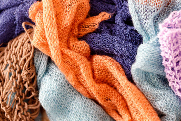 istock Knitting Wool Texture. Background texture of pattern knitted fabric made of cotton or wool closeup 1303885574