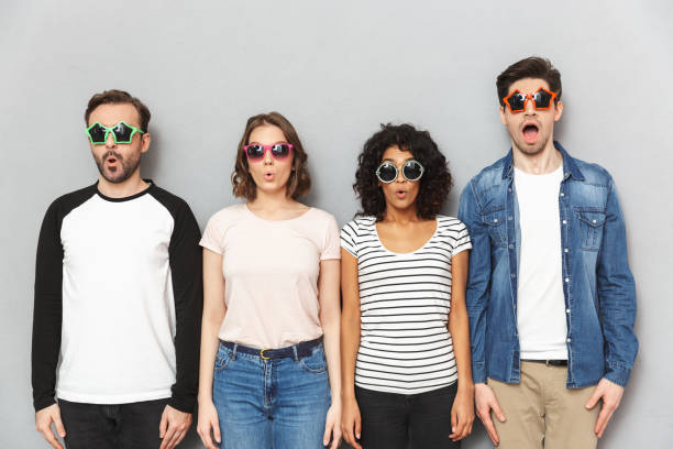 istock Shocked group of friends looking camera. 1303887211