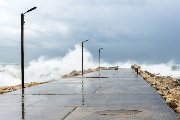 istock Waves crashing on a groyne, Byblos 1303887762