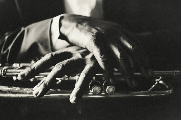 The hands of the musician Trumpet, vintage, dark, art, jazz, trumpet player, hand, light and shadow, musical instrument photos stock pictures, royalty-free photos & images