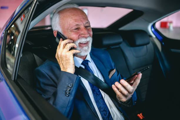 istock Busy businessman talking on two phones 1303888885