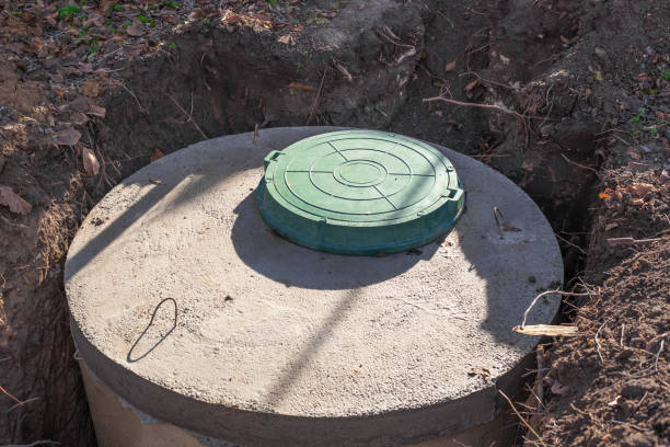 Septic tank made of concrete rings with a hatch for a private country house. Wastewater and sewerage drainage Septic tank made of concrete rings with a hatch for a private country house. Wastewater and sewerage drainage. reservoir photos stock pictures, royalty-free photos & images