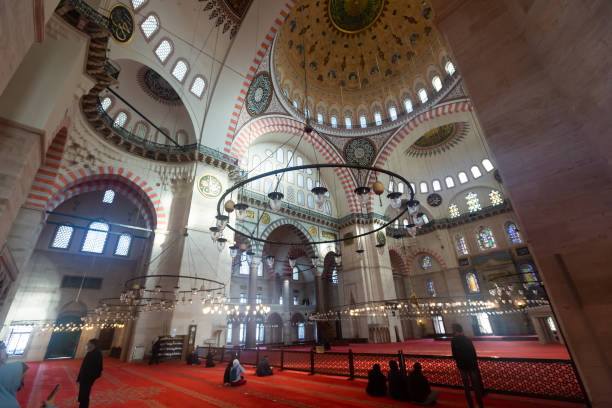 Interior of ancient Suleymaniye Mosque, Istanbul, Turkey ISTANBUL, TURKEY - January 01, 2021: Inside view of Prayer hall of famous mosque  Suleymaniye Camii in Istanbul turkey koran people design stock pictures, royalty-free photos & images