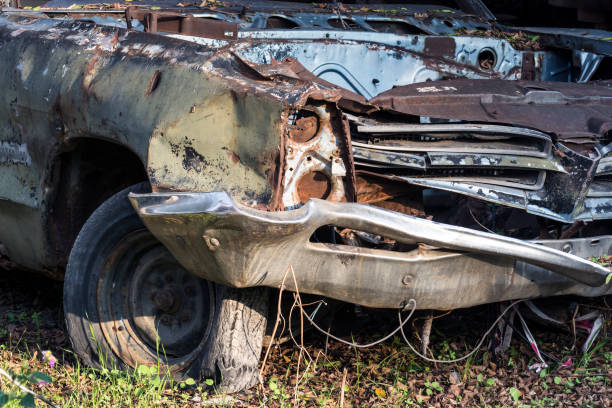 istock Old abandoned broken car and damaged tire 1303892405