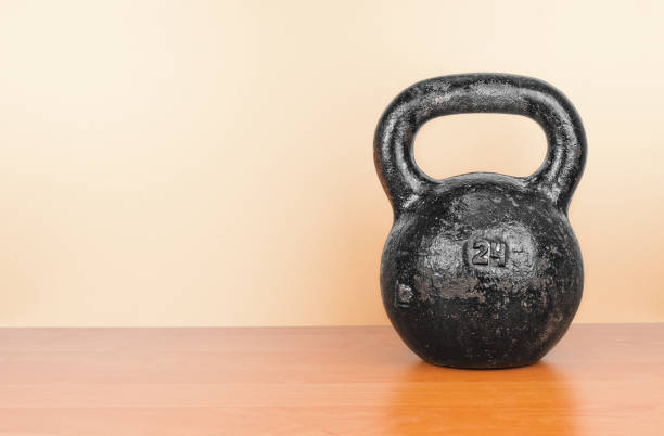 istock Heavy kettlebell close up on a wooden background 1303892704