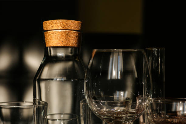istock Different glassware on dark color wooden background 1303893478