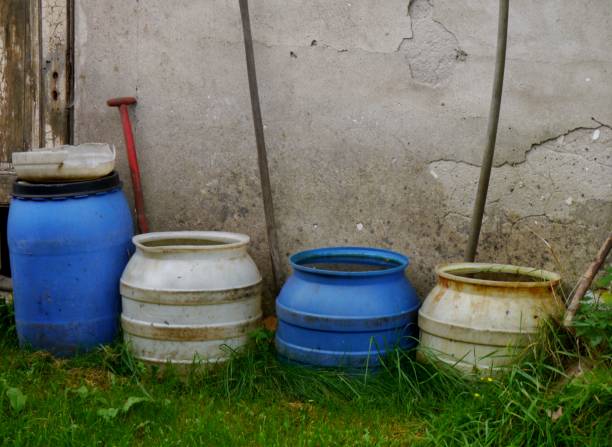 istock Rain barrels on the house wall 1303894733