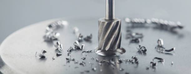 istock Milling cutter make sink in hole in steel billet. Locksmith work. 1303895306