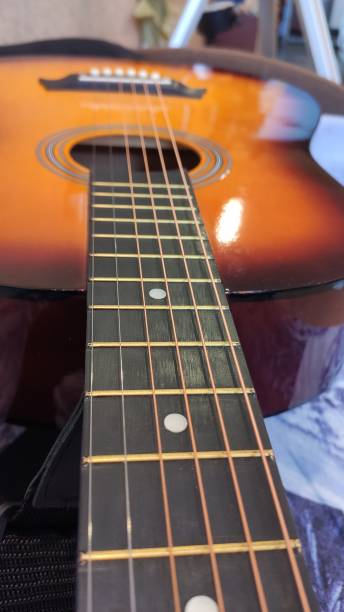 istock Acoustic guitar neck. 1303896670