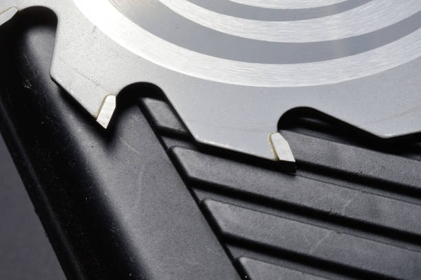 istock The circular saw blade rests on the plastic tool box. close-up. 1303898835