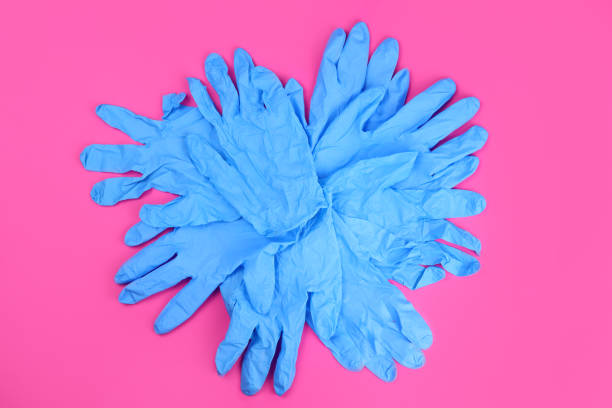 istock rubber gloves for homework on a pink background 1303899219