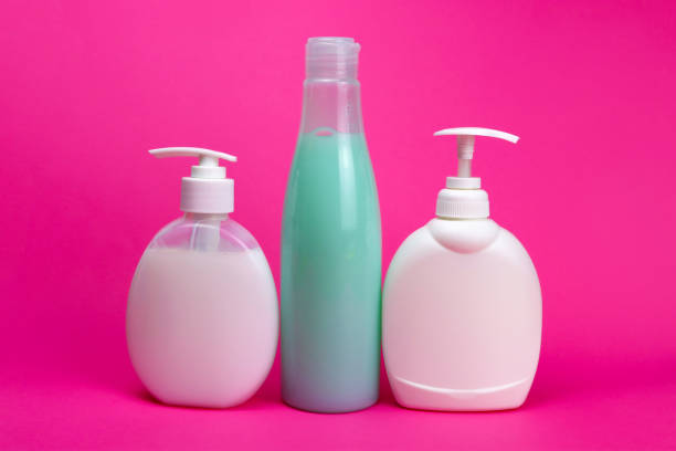 istock shampoo and liquid soap in a bottle with a dispenser on a pink background 1303899230