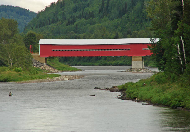 istock Red Wooden Covered Bridge 1303903434
