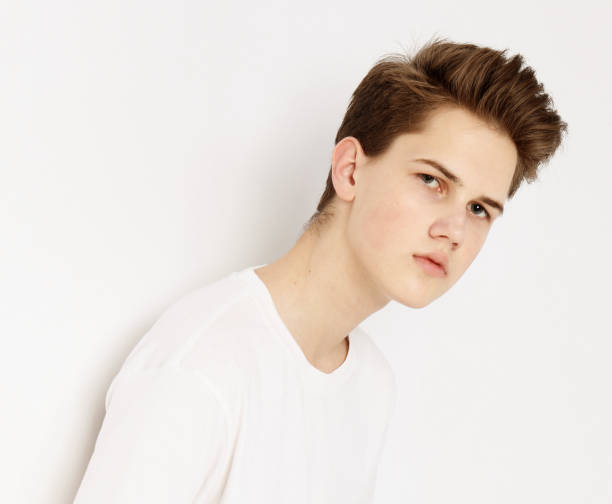 istock Attractive Young Male Model wearing white t-shirt posing in studio 1303908132