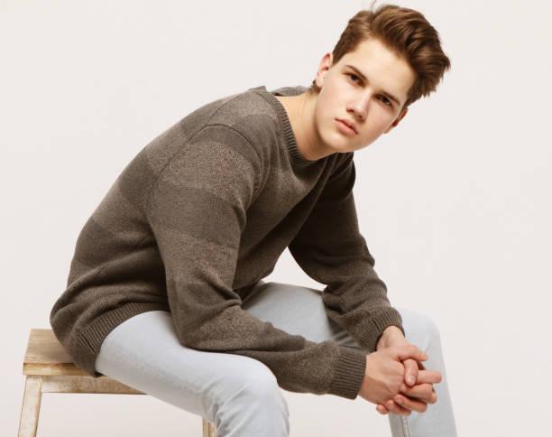 istock Attractive teenage boy posing in studio 1303908195