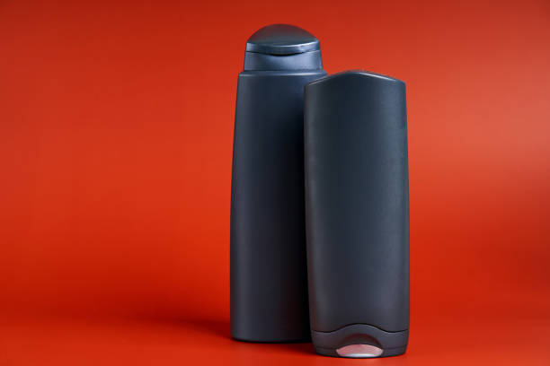 istock Two blank dark plastic container of shower gel or shampoo 1303908562