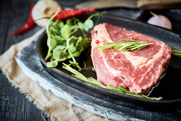 istock Raw  steak androsemary 1303909597