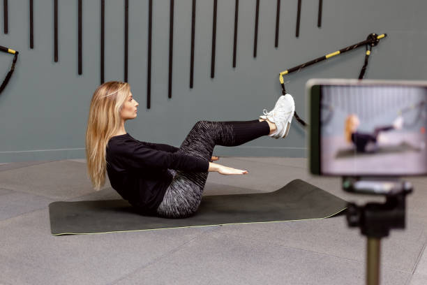 istock Record video lesson on training sport at gym 1303910927