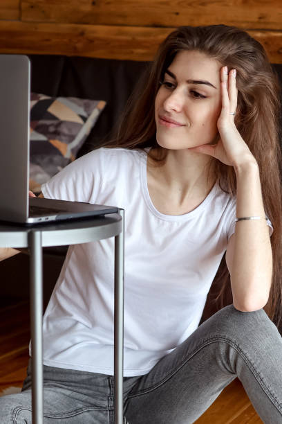 istock woman enjoys watching educational webinar on laptop 1303910936