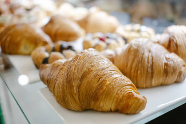 Tasty fresh croissants on counter. Close up. Selective Focus