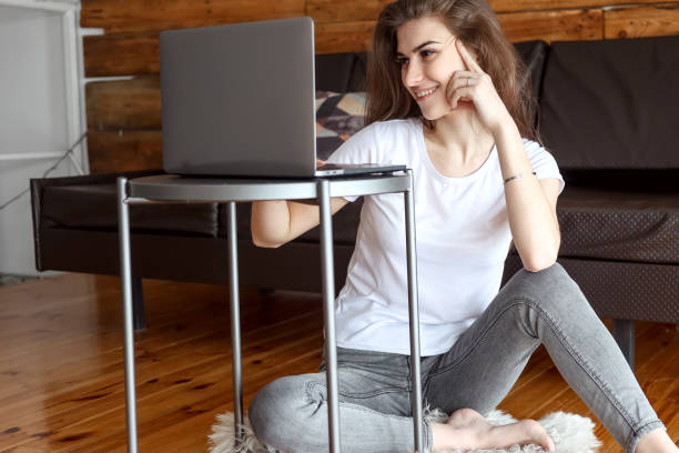 istock woman enjoys watching educational webinar on laptop 1303911141