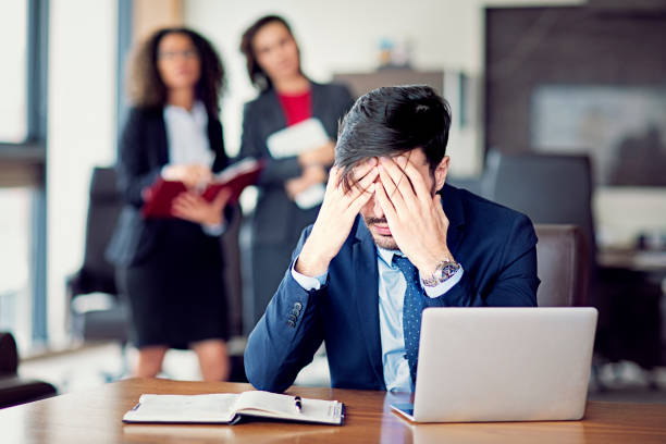 istock Burnout businessman under pressure in an office 1303914073