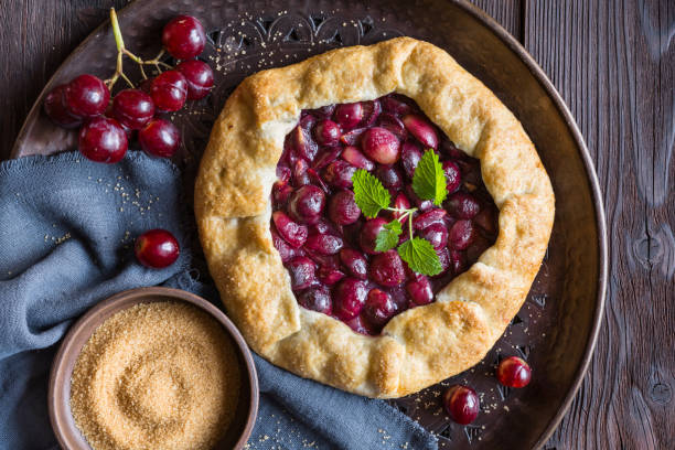 istock Traditional homemade Galette pie with red grapes 1303915333