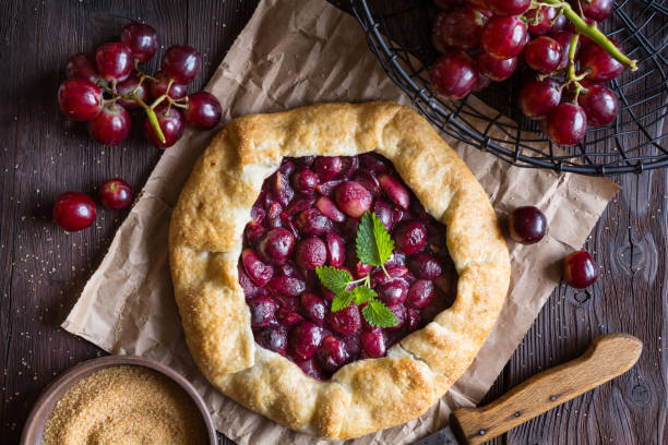 istock Traditional homemade Galette pie with red grapes 1303915355