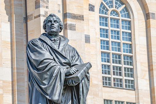 Monument of Martin Luther at  Neumarkt square in downtown of Dresden, a theologist, composer, priest, who has started Reformation in Catholic Church, Germany, details, closeup