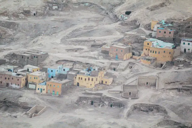 Photo of View of a small village built among ancient Egyptian graves