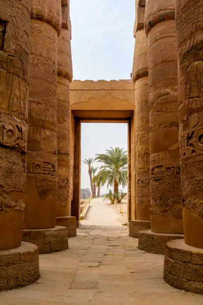 Photo of View through the majestic columns of Karnak temple through a gate