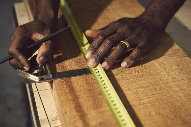 istock Cropped Hands Of Carpenter Working At Workshop 1303920647