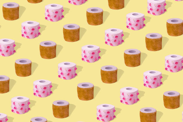 istock Popular creative idea with toilet paper with diamonds and glitter, pattern on a yellow background. 1303920959