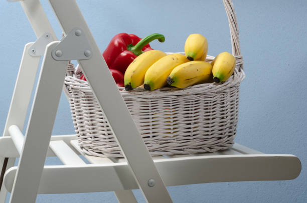 A basket full of vegetables and fruits stock photo
