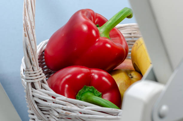 A basket full of vegetables and fruits stock photo