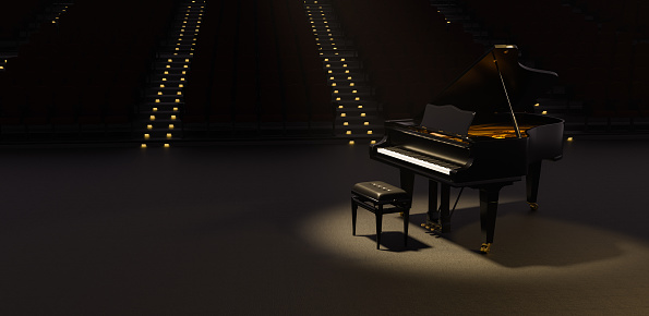 grand piano illuminated by a spotlight in a theater with many seats behind with illuminated stairs. 3d render