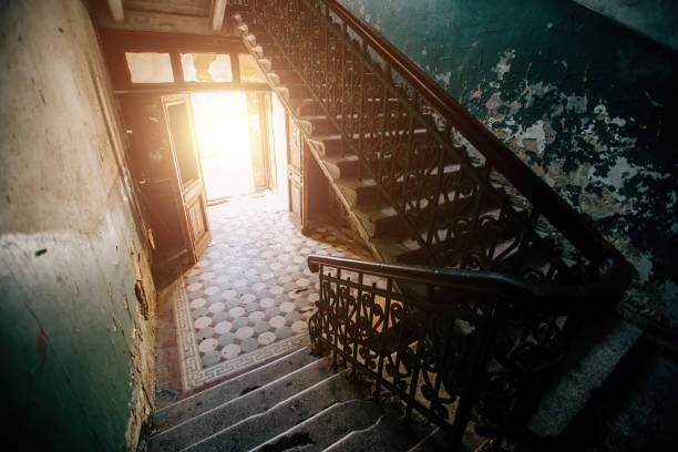 istock Old vintage staircase at the old abandoned building 1303927228