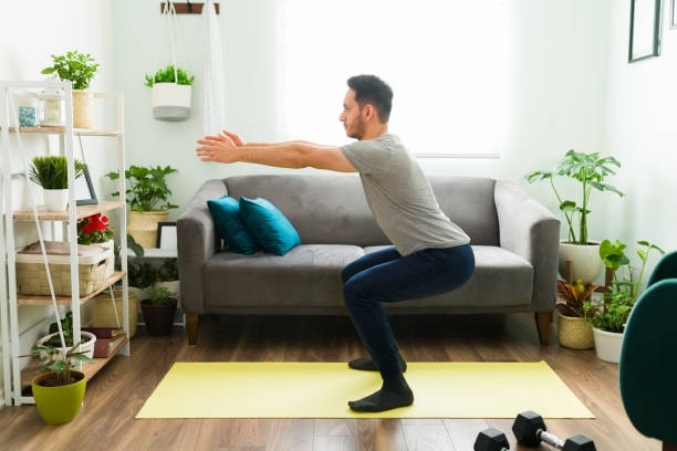 istock Side view of a fit man doing a home workout 1303927478