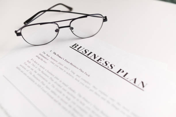 istock Business plan scrutiny concept. Flat lay on white table. 1303927773