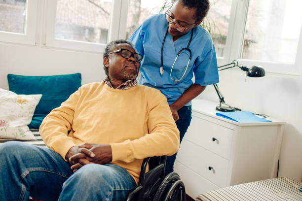 istock Senior man is having doctor's visit at home. 1303928613