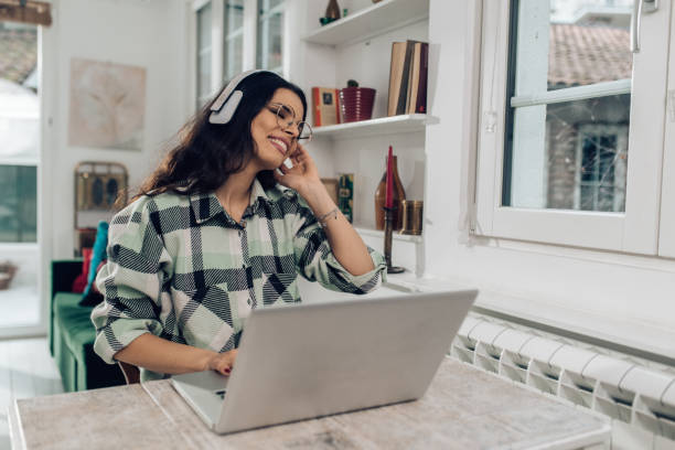 istock Portrait of a young freelancer relaxing with music while working online 1303928866