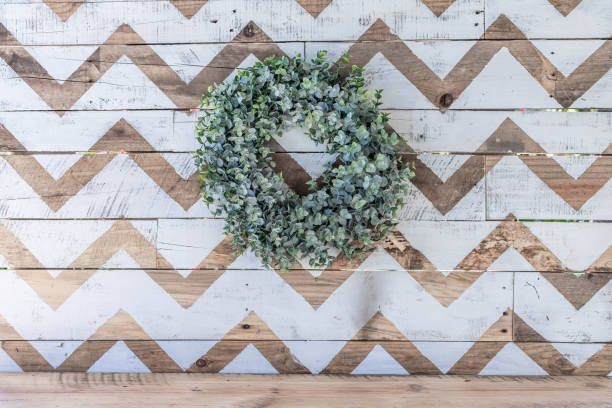 istock White and natural chevron print background with eucalyptus wreath 1303929672