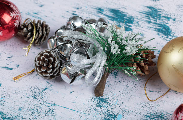 istock Festive baubles and pinecones on colorful background 1303938000
