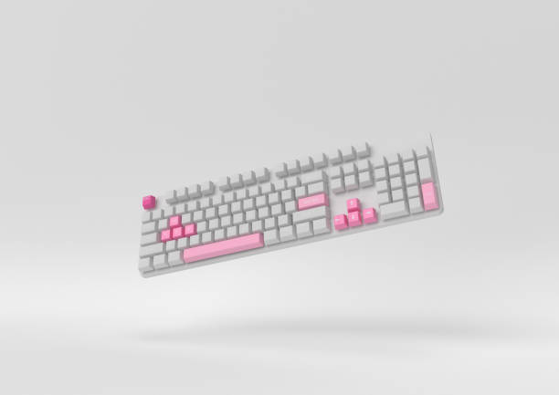 istock pink computer keyboard floating on white background. minimal concept idea. Pastel colors. 3d render. 1303938727