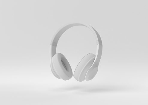 auriculares blancos flotando sobre fondo blanco. idea conceptual mínima. Monocromo. Renderizado 3D. photo