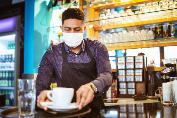 istock Young African-American barista 1303940459