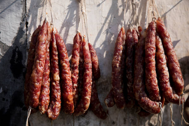 Chinese sausage being hung out to dry in the sunlight in Anhui, China.