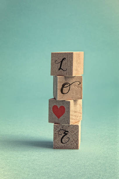 istock Love blocks stacked on blue background 1303943466