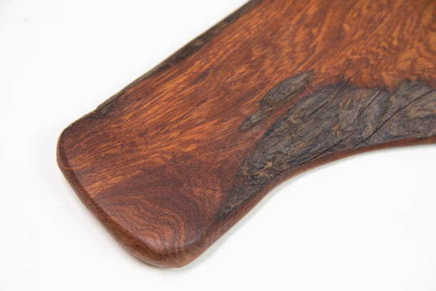 istock Close up wood texture cutting board on white background. 1303945973